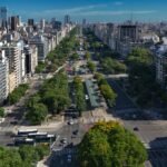 an aerial view of a city with tall buildings